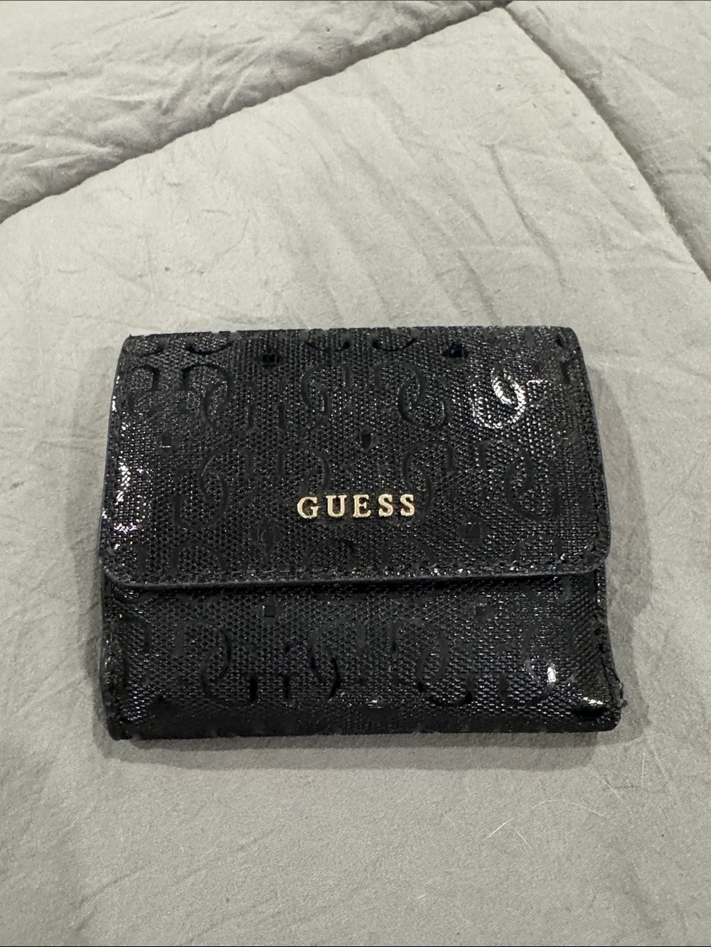 G by Guess Black Logo-Embossed Foldover Wallet with Gold Tone Logo